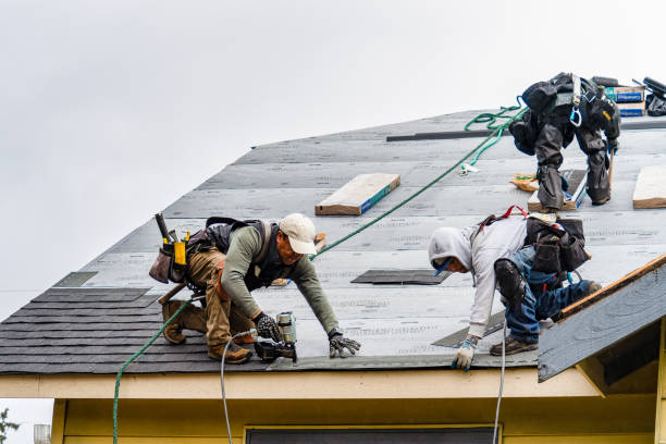 Professional Gutter Installation technician working in Kensington, NY